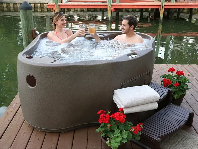 Couple relaxing in an AquaRest AR600 hot tub
