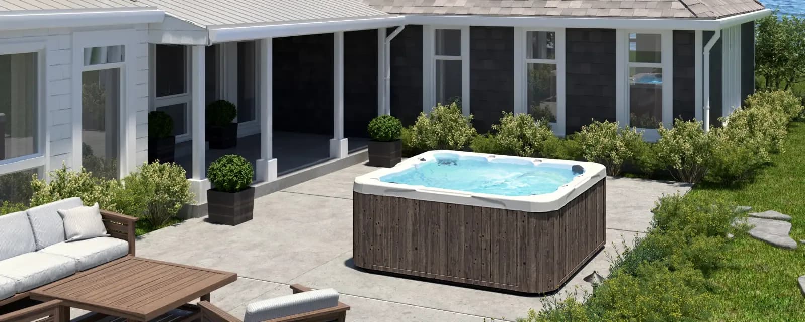 Dimension One Aurora hot tub with an UltraLife White shell and Sandalwood cabinet in a fall setting