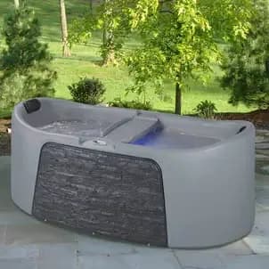 Strong Spas Durasport hot tub in a wooded setting